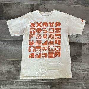 Nike graphic tee, cream & orange, & size MEDIUM.